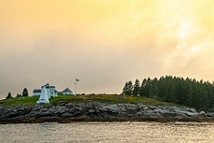 Sun Breaks Through Overcast Clouds at Tenants Harbor Light